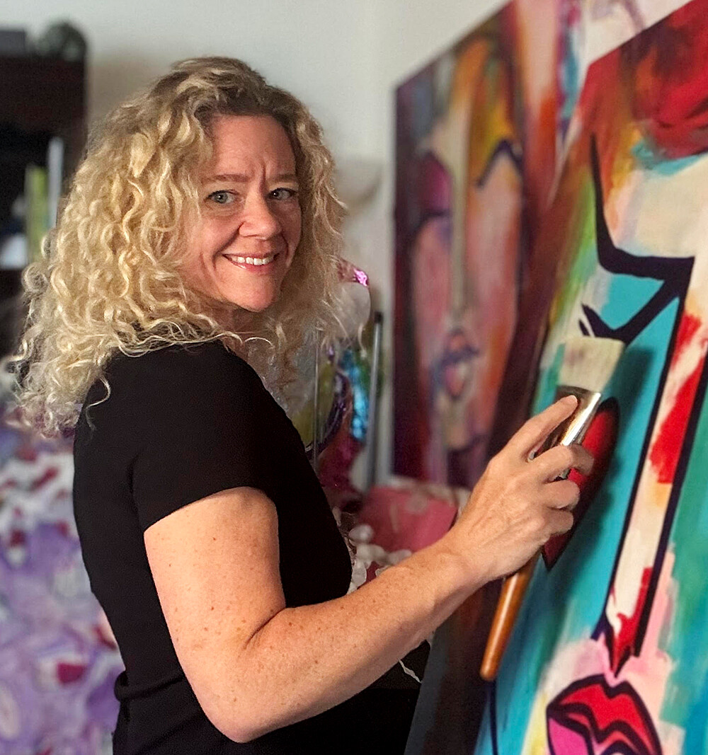 Virginia Huling painting in her studio